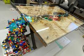 The table works well as a coffee table that has great storage and offers hours of fun lego. Man Created A Custom Coffee Table With Lego Dioramas That A Lego Waterfall Spilling Out On One Side Shouts