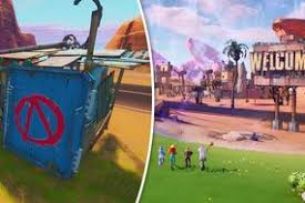Fortnite Where To Search Between A Film Camera Stone Head And Big Rig
