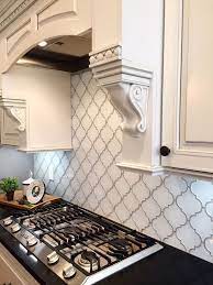 Arabesque Backsplash In White With Grey Joints Near A Black Counter Top With An Inbui Kitchen Backsplash Designs Kitchen Remodel Countertops Kitchen Remodel