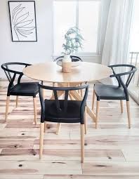 The small kitchen dining table has a wood surface that matches the countertops. Pin On Home Ideas Einrichten Dining Room Small Black Dining Chairs Dining Table Chairs