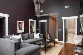 Modern interior living room with grey concrete wall, sofa, black lamp and palm tree. 40 Living Rooms With Gray Couches Photos Home Stratosphere