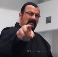 Steven Segal points at you and says “I'm going to teach this person a  lesson”. Then he gets into his Aikido pose ready to square off. What do you  do?
