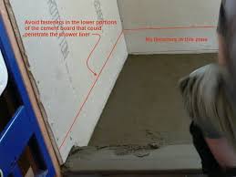 If adhesive is called for, spread it within the area where the shower pan will sit. Embed Bottom Edge Of Cement Board Into The Top Mortar Layer Of Shower Bed Leave Gap Of At Least 1 2 Shower Pan Building A Shower Pan Shower Pan Installation
