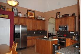 Nice Contrast To Deep Red Accent Wall In Kitchen Brown Kitchen Cabinets Accent Walls In Living Room