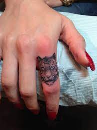 Pin By Ashton Williams On Tattoos Tiger Tattoo Finger Tattoos Finger Tattoo Designs