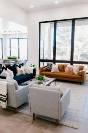Living Room Mix And Match Patterns Accept Bold Shades Layer Rugs And So Far More A Lounge Furniture Layout Living Room Arrangements Apartment Living Room