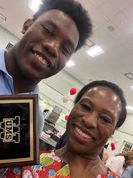Rookie of the year with his mother, April.