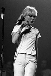 I'll walk down the mall stand over by the wall where i can see it all find out who ya call lead you to the supermarket checkout some specials and rat food get lost in the crowd. Blondie Band Wikipedia
