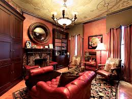 Small sofa or comfortable chair, writing desk, and ladder for bookshelves extended to the ceiling, floor carpet, and efficient lighting create cozy home library designs and decorating for small rooms. 12 Dreamy Home Libraries Hgtv