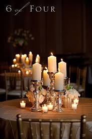 45 Candlestick Centerpieces That Will Light Up Your Reception Wedding Candles Table Wedding Centerpieces Candlestick Centerpiece Wedding