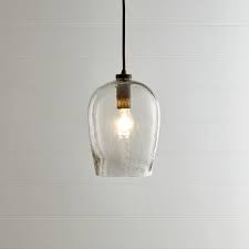 Crate and barrel's bell hammered glass pendant light is $99.95 and is made in india. High Low Glass Bell Shaped Pendant Remodelista Glass Pendant Light Pendant Light Clear Glass Pendant Light
