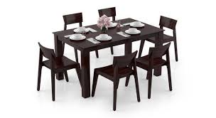 To avoid hiding a utensil under the rim of a plate or bowl, lay it approximately one (1) inch away from the plate's side. Arabia Gordon 6 Seater Dining Table Set Urban Ladder