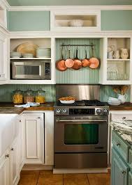 The backsplash contains squared, cream travertine tiles from kitchen hood to the kitchen's countertop. Kitchen Backsplash Inspirations French Country Cottage