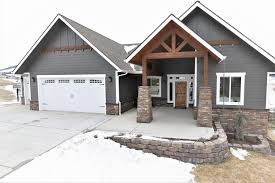 Charcoal Siding Board And Batten Accent With Wood Accent But With Red Brick House Exterior House Colors House Paint Exterior