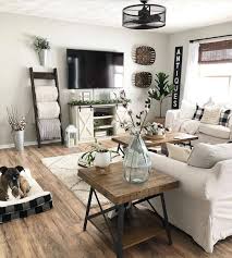 Farmhouse living room decor, hanging planter with greenery or flowers, rustic wall decor, sconce with flowers, country wall decor, farmhouse. Farmhouse Homes On Instagram This Farmhouse Inspired Family Room Is Modern Farmhouse Living Room Decor Farmhouse Decor Living Room Small Space Living Room