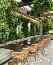 Find the restaurant to the left upon arriving through the main doors. Garden Vibe Restaurant Design Filled With Organized Living Plants Diseno De Interiores Del Restaurante Patio De Restaurante Restaurante De Lujo