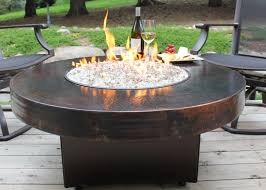 A rounded fire pit table makes your outdoor space look prettier. 10 Best Outdoor Fire Pit Ideas To Diy Or Buy Gas Tabletop Fire Pit