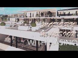 Soft gray cabinetry, hardwood flooring, along with a black and brass lacanche range, help to balance the look. Modern Mansion With Casino Bloxburg House Build Tour And Layout Velatea Youtube In 2021 Beautiful House Plans Design Your Dream House Modern Mansion