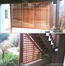 A cedar fence featuring square lattice and chunky posts creates a decorative yard. Decks And Fences Robertwarren Cool