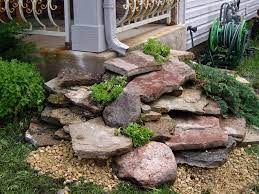 If you want to plant grass in the drainage ditch, lay landscape cloth over the gravel in the bottom, then cover the cloth with more gravel or stones. 11 Attractive Landscape Drainage Solutions Fra Dor Tips
