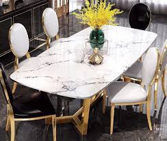 Many people are replacing their old dining table with metal table. Golden Geometric Metal Base Dining Table My Aashis
