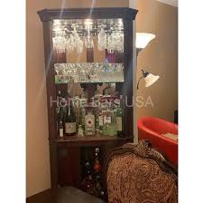 It features four raised panel doors with antique brass finished hardware. Howard Miller Piedmont Corner Wine Bar Cabinet 690 000 Home Bars Usa