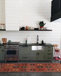 The cabinets have glass fronts and painted with green with white background. Instagram Photo By Jenny Komenda Jul 28 2016 At 2 41pm Utc Kitchen Cabinets Decor Green Kitchen Cabinets Kitchen Interior
