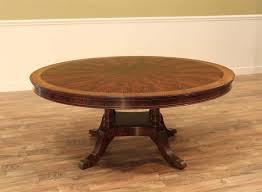 The metal base is a dark black iron finish and the top of the table is a unique storm gray finish. 72 Inch Round Mahogany Dining Room Table