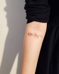 Small, delicate, elegant and even discreet. Rose Tattoos Symbolism Designs And Placement