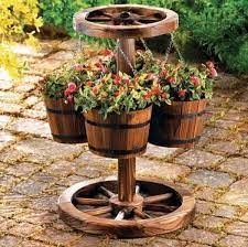 Design A Beautiful Garden Using Rustic Elements Rustic Planters Wood Barrel Planters Rustic Gardens