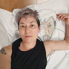 Beaded embroidered self-portrait artwork