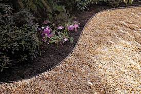 Continue laying the stones, one beside the other. Improving Your Garden With Decorative Stone Grabco