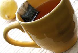 Free Picture Yellow Ceramic Cup Contained Hot Water Resting Rim Steeping Tea Bag