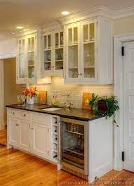 Wet bar cabinets are a nice touch and add a different spin to your custom kitchen designs, allowing you to have alcohol easily available at your fingertips. Wet Bar Traditional White Kitchen Cabinets Kitchen Design White Kitchen Traditional