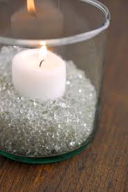 Sometimes we feel the need to bring some, joy begin by dampening the surface of the vase with the paper towel. Having A Small White Votive In A Wide Cylinder Vase Nestled In Some Clear Glass Bead Filler Effortlessly M Hurricane Candles Hurricane Vase Candle Vase Fillers