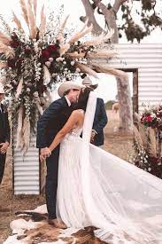 Iron Wedding Arch With Plumes Of Pampas Grass And Burgundy Flowers Country Wedding Photos Western Themed Wedding Country Theme Wedding