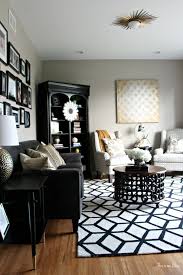 It includes pink sofas on a square patterned velvet rug. Black And White Rugs For Living Room Novocom Top