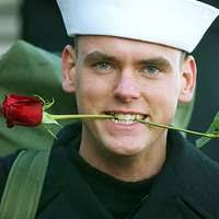 Machinist's Mate 3rd Class Julia Gardner melts plastic in a waste  management room aboard the aircraft carrier USS Theodore Roosevelt (CVN  71).