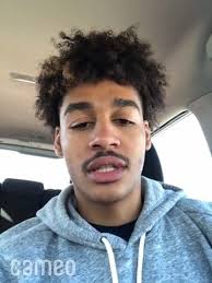 Jordan Poole, former Michigan basketball player, congratulates NLNC...