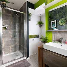 Don't just stick with square tile layouts. Green And Grey Bathroom Makeover With Lush Foliage