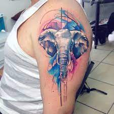 Innovating Watercolor Tattoos By Adrian Bascur Watercolor Elephant Tattoos Elephant Tattoos Elephant Tattoo Design