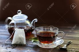 Simply wedge a warm, wet tea bag against the gum and surround the tooth. Cup Of Black Tea Tea Leaves Teapot Tea Bag On Wooden Background Stock Photo Picture And Royalty Free Image Image 110956914