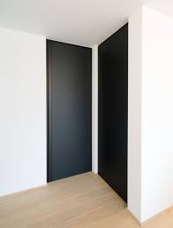 Modern Black Interior Doors From Floor To Ceiling With An Integrated Vertical Handle Doors Interior Modern Black Interior Doors Doors Interior