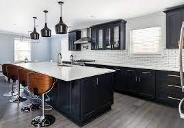 The deep matte black of the cabinets and surfaces provides a sleek backdrop to the beautifully detailed wood grain. Beautiful Black Kitchen Cabinets Design Ideas Small Kitchen Cabinet Design Black Kitchen Cabinets Kitchen Cabinet Design