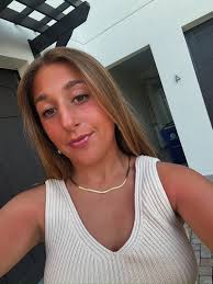 What are good options for a female softball pitching coach for my daughter?