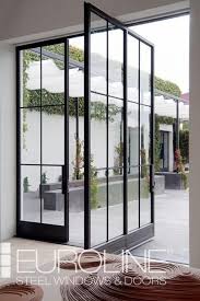 This pivot door features high quality european designed and inspired pivot doors, featuring tempered frosted glass up to four times stronger than regular glass. Pivot Doors Euroline Steel Windows Modern Windows Exterior Black Exterior Doors Steel Doors Exterior