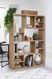 Despina design pattern of the room divider brings a hint of mediterranean charm to the contemporary living space design: Next Oak Room Divider Natural Wooden Room Dividers Shelving Units Living Room Living Room Divider