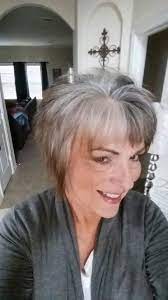 Slender, with platform shoes and long, feathered hair. After 5 Months No Color Gray Grow Out Grey Hair Inspiration Gray Hair Growing Out Gorgeous Gray Hair