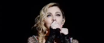 madonnas medellin single plummets early celebrityaccess