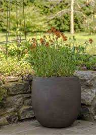 Create a bright and beautiful herb garden by stocking up on a few of these lovely yellow pots. Beautiful Natural Looking Savanne Bolla Rounded Bottom Garden Planter Iota Uk Garden Planters Planters Garden